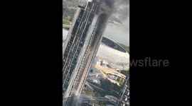 Flames burst out of high-rise building in China following gas explosion