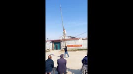 Performer climbs bamboo pole in China