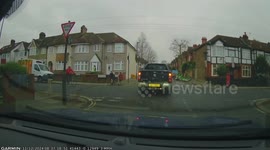Cyclist cuts corner and almost rides into car pulling up to the junction