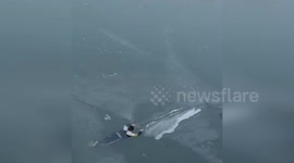 China: Firefighters Crawl Across Ice to Rescue Girl Trapped in Frozen Pond