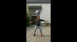 Acrobat balances giant jar with ease in China