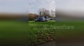 Santa arrives by helicopter to visit schools in Dorset, England