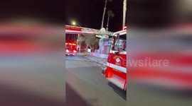 Firefighters struggle with high wind to contain Westminster blaze in California