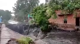 Landslide swallows up homes during floods in Indonesia