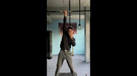 Solo strength: A man in China masters one-armed pull-up in gym