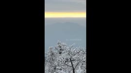 Golden skyline appears after snow at Tianmen Mountain, China