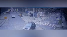 Girl waiting for bus saves herself by running to the side after seeing car heading her way