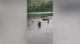 Stranded whale rescue by locals in Indonesia