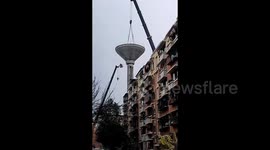 Water tower collapses after crane arm snaps, killing 1 worker in China