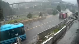 Truck transporting sand topples over before slamming into oncoming bus in China