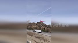 Helicopters dump water on Madera Fire in Simi Valley, California