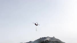 Helicopter drops water on Franklin Fire in Malibu, California