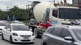 Flower seller couple wear Santa suits in Thailand