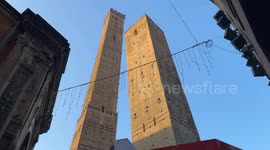 The two towers, Garisenda and Asinelli, illuminated by the morning sun in Bologna.