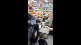 Cat stands on two feet while attending store in Shanghai, China