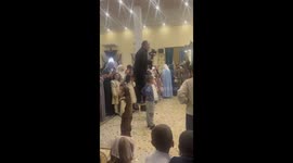 Cameraman skillfully maneuvers on a chair during a wedding in Khasavyurt, Russia