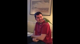 Squawks the Quaker Parrot has a good laugh with his owners