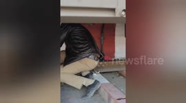 Rail Police resque a While boarding a moving train, the woman's foot slipped and she fell between the platform and the train in Bareilly,Northern India