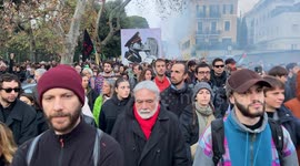 A large sign featuring Giorgia Meloni and Benito Mussolini kissing among people during the protest march against the security decree organized by the Rete No DDL Sicurezza (no security decree law network) in Rome.