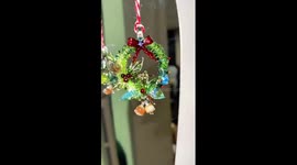 Craftsman uses glass blower to create miniature Christmas wreath