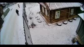 Drunk men struggle with a fence in Yanaule, Russia