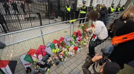 Children's toys and flowers laid outside Downing Street in London during the Rally for Palestine