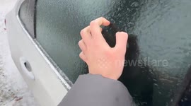 US: Car Windows Frozen Amid Ice Storm In Iowa