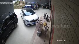 Woman moves scooter carelessly in Guangdong, China