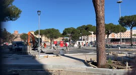 Workers at work on Sunday at the construction site of the urban redevelopment works in Piazza dei Cinquecento in front of Termini Station in Rome.