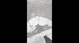 Breaking ice with a blower in Detroit, Michigan, USA