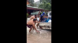 Tourists battle through floods on Thai 'Death Island'