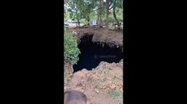 This gaping hole in the ground leads to a secret cave pool