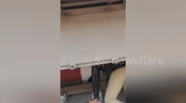 Brave station guard rescues passenger who fell between train and tracks