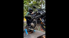 Man practices wheelie on superbike simulator in Hyderabad, India