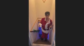 Drunk guy in Santa costume trips and falls down stairs in Lubbock City, Texas, USA