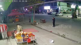 Father and daughter topple off scooter that flips over as soon as he hops on