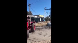Car breaks through police barricade and drags motorcycle in India