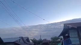 Large wall cloud hovers over homes like frozen tsunami wave