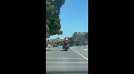 Santa Rides a Motorcycle Through Cape Town