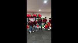 Male workers put on diaper pants for amusing office party game