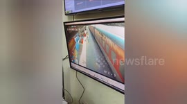 Station guard saves woman being dragged by train carriage in India