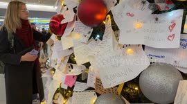 A wish card bearing the words ‘Democracy for Romania and Myanmar’ was hung among other wish cards on the decorated Christmas tree installed at Termini Station during the Christmas period in Rome.
