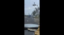 Vehicle load tilts dangerously off one side in Yunnan, China