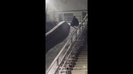 Person slides down snowy ramp in China