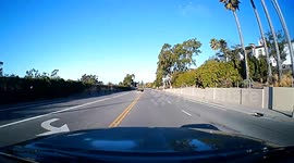 Close Call: Red Light Runner Almost Sideswipes Oncoming Vehicle