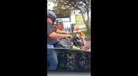Man's Motorbike Covered In Toys