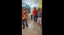 Elderly friends play amusing Christmas party game