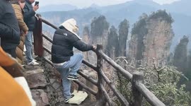 Tourist has bizarre fight with wild monkey in China