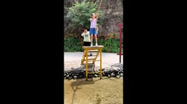 Boy has a funny fall from rope swing in China