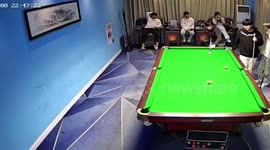 Sore loser snooker player kicks a hole through wall when he misses pot